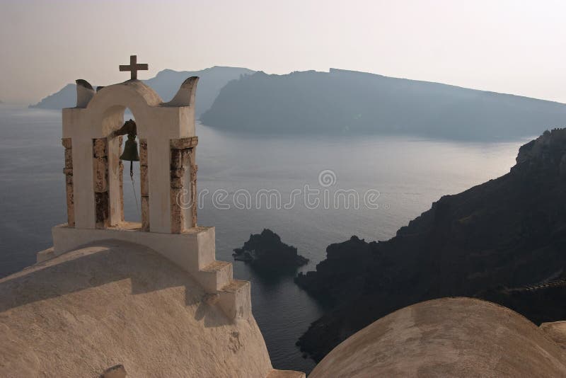 A greek orthodox church in Oia with sea background, Santorini