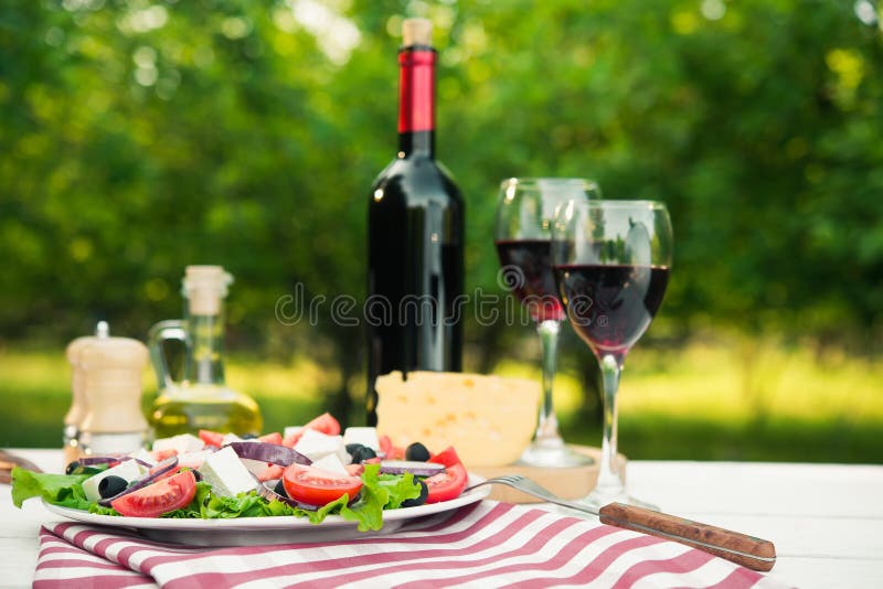 Greek salad and glass of wine