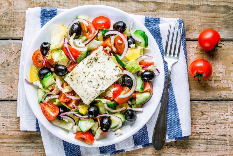 Greek salad of organic tomatoes, cucumber, red onion, olives and feta cheese