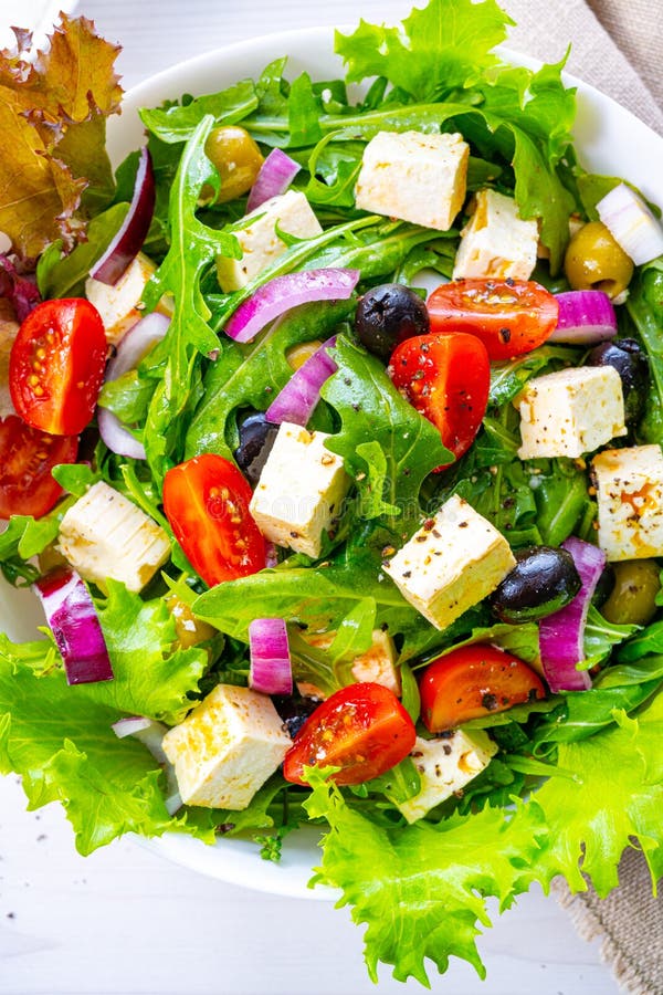 Greek salad with sheep`s cheese a delicious classic. A Greek salad with sheep`s cheese a delicious classic royalty free stock images Greek salad with sheep`s cheese a delicious classic. A Greek salad with sheep`s cheese a delicious classic royalty free stock images