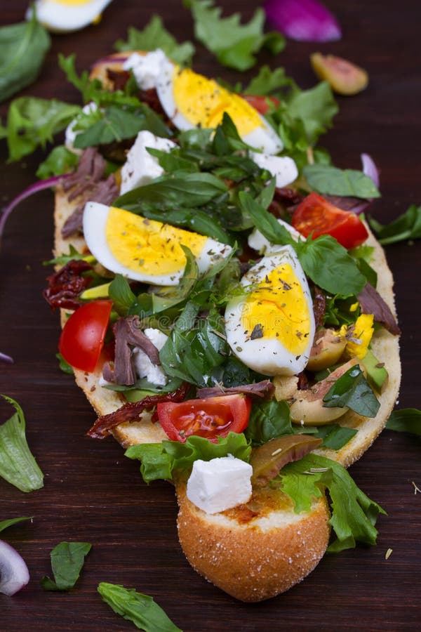 Greek Steak Salad on Bread with Eggs and Feta. Stock Photo Image of
