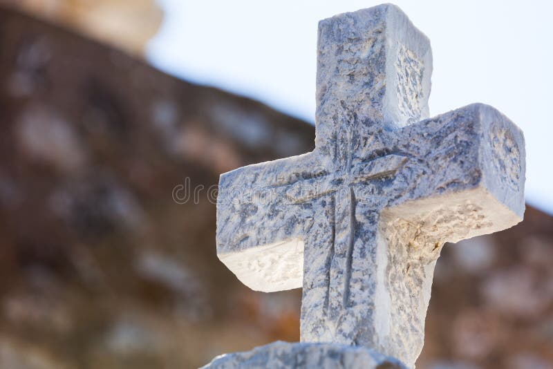 Greek stone cross on burial ground