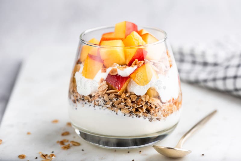 Greek yogurt parfait with granola and peach