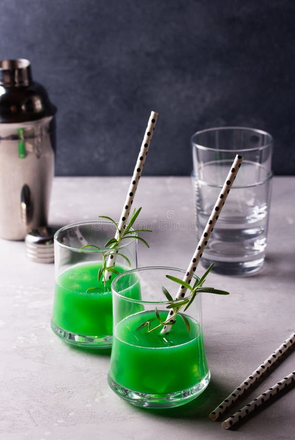 Green Alcohol Cocktail with Apple and Rosemary. Stock Photo Image of