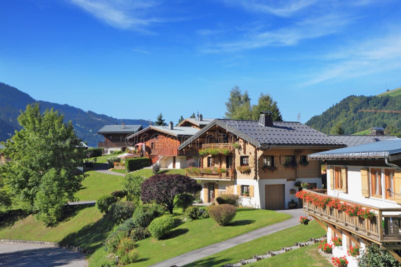 Green alpine meadows and chalets.