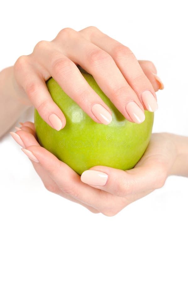 Green apple in a beautiful hand of woman