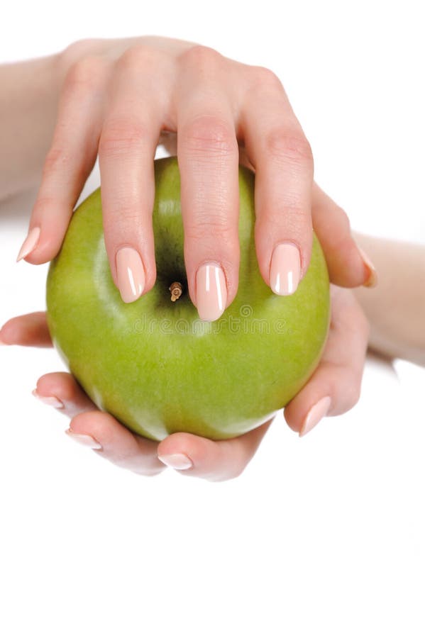 Green apple in a beautiful hand of woman