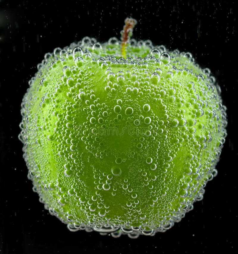 Green apple with bubbles stock photo. Image of flowing 35010094