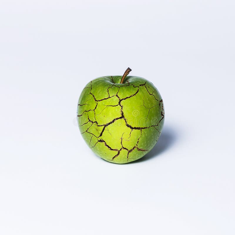 Green apple cracked on white background