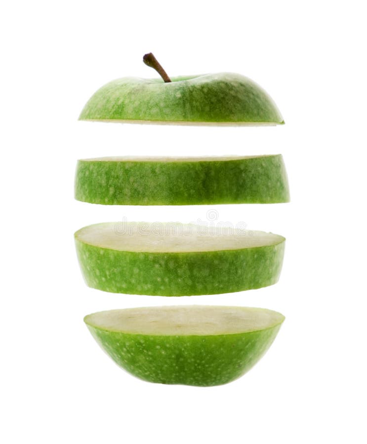 Green apple cut into slices isolated over a white