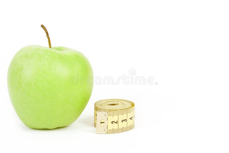 Green apple and measuring tape isolated on white background