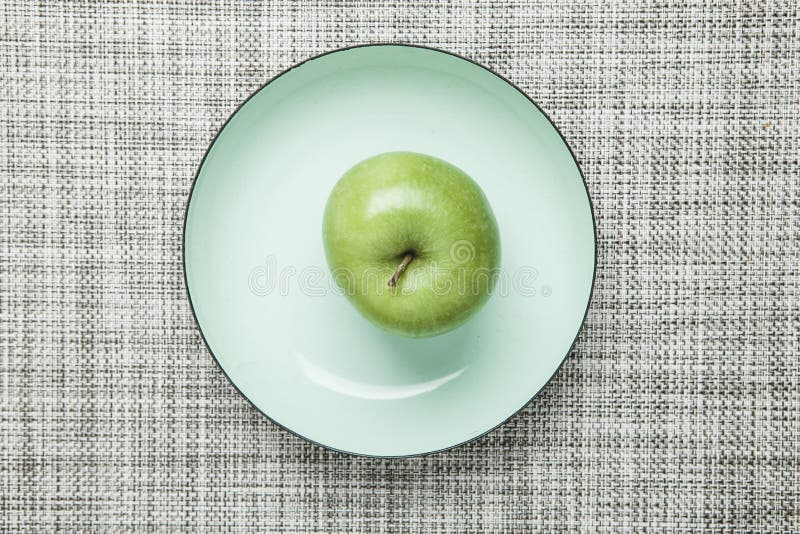Green apple on plate stock image. Image of fruit, food - 50472755