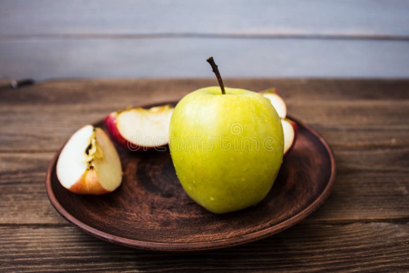 Green Apple on a Plate on Wooden Background Stock Image - Image of ...