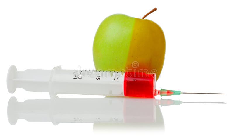 Green apple and a syringe with red liquid