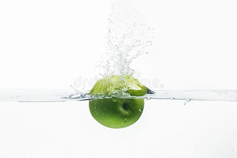 Green apple thrown in water shot