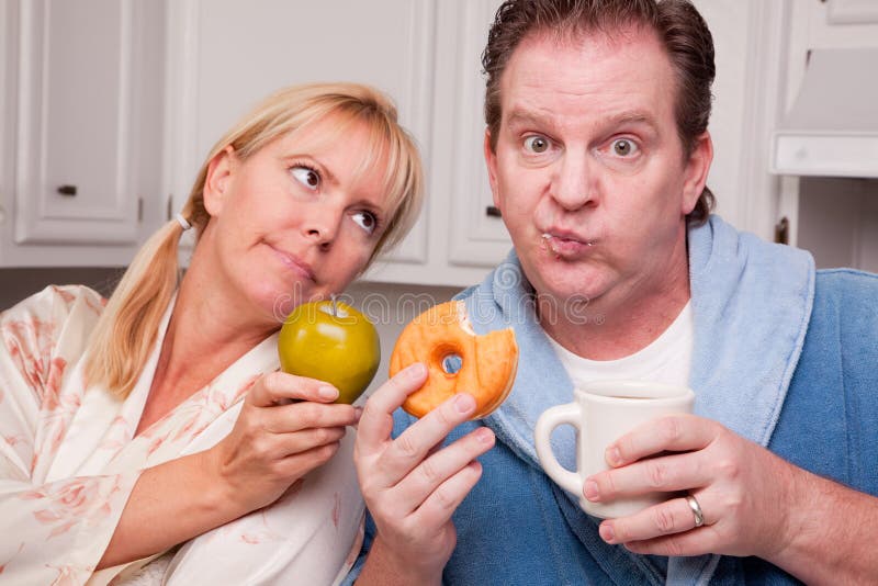 Green Apple vs. Donut Healthy Eating Decision royalty free stock photos Green Apple vs. Donut Healthy Eating Decision royalty free stock photos