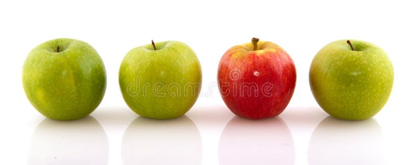 Green apples with one red one stock photo