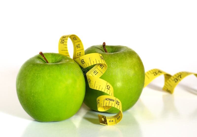 Green apples and tape measure royalty free stock photos