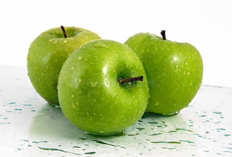 Green apples with waterdrops royalty free stock photography