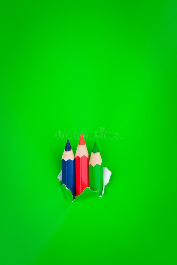 Green background with pencils royalty free stock photography