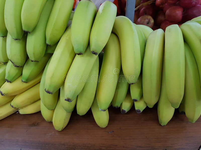 Green bananas in the store stock image. Image of pile 139190313