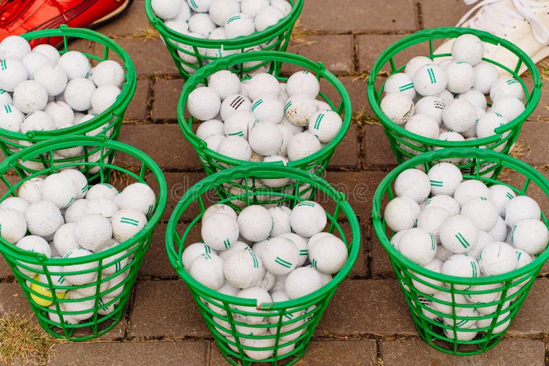 Green Baskets of Golf Balls. Accessories for the Game. Stock Image