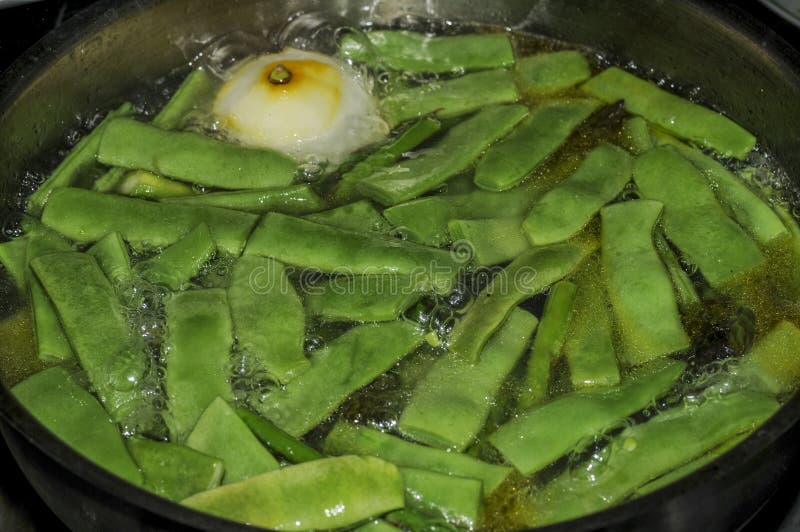 Green Beans Cooking in a Pot in the Kitchen. Stock Photo Image of