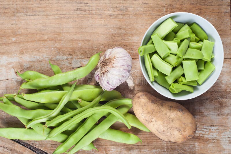 Green Beans, Potato and Garlic, on a Wooden Table Stock Photo Image