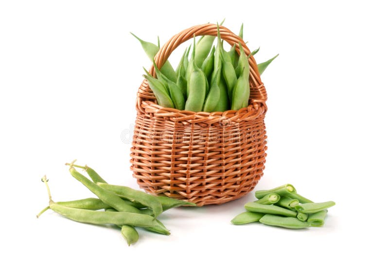 Green beans in a wicker basket isolated on a white background.