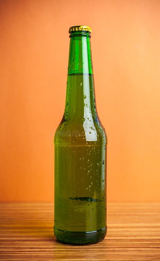 Green beer bottle stock photo. Image of drop, alcohol 70231958