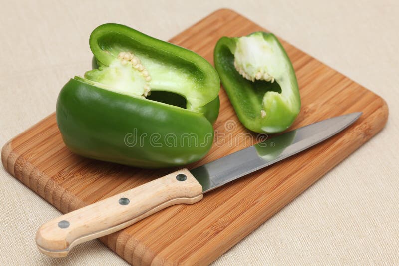 Green Bell Pepper on a Cutting Board Stock Image Image of knife