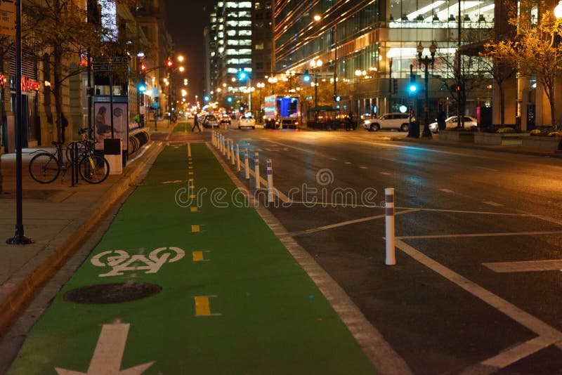 Green bike lane at night