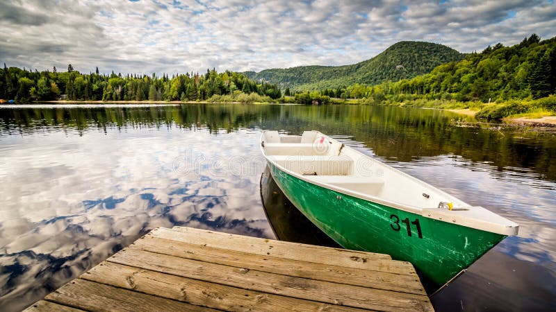 Green boat on the lake