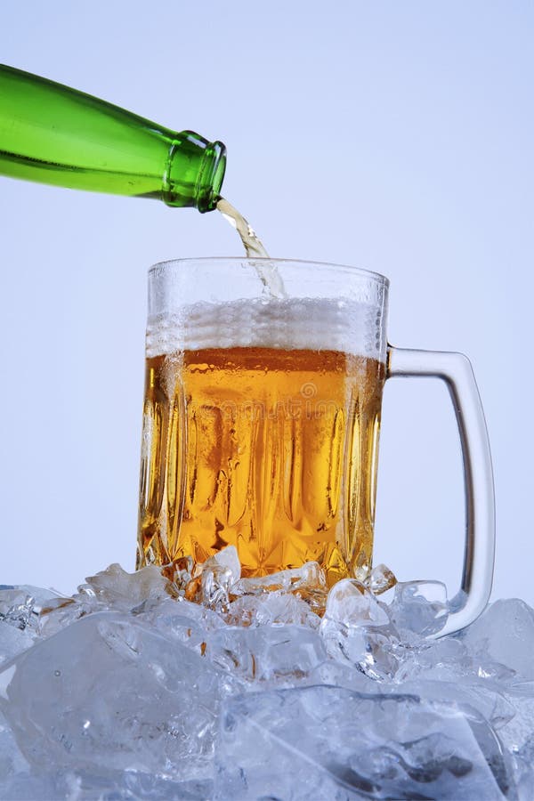Green Bottle Pouring Cold Beer into a Glass Stock Image Image of