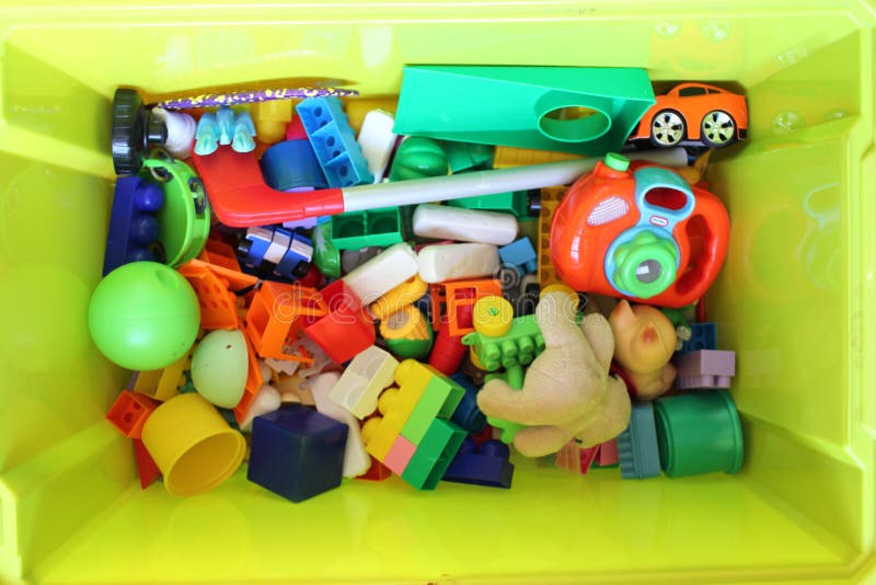 Green box with children`s toys stock images Green box with children`s toys stock images