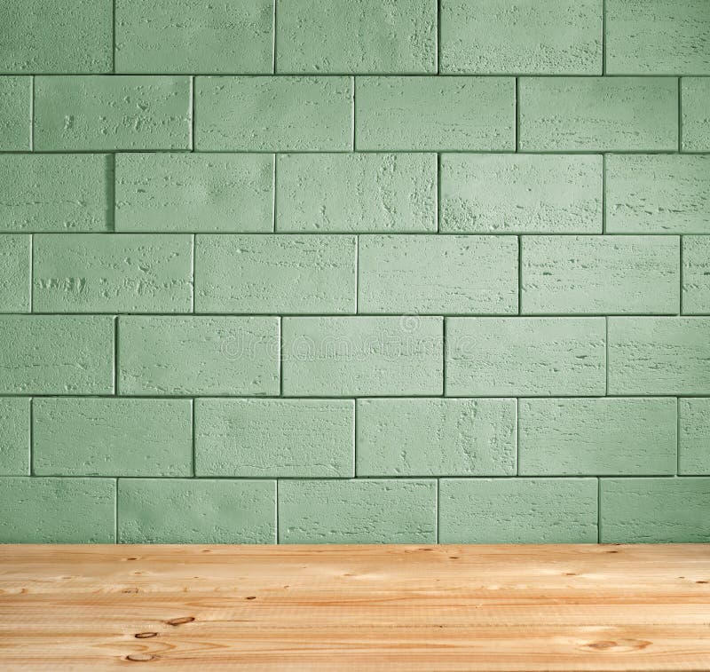 Green brick background and wooden floor