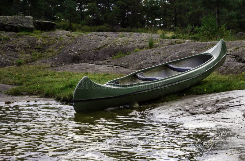 Green Canoe and Dock on a Misty Morning Stock Image Image of