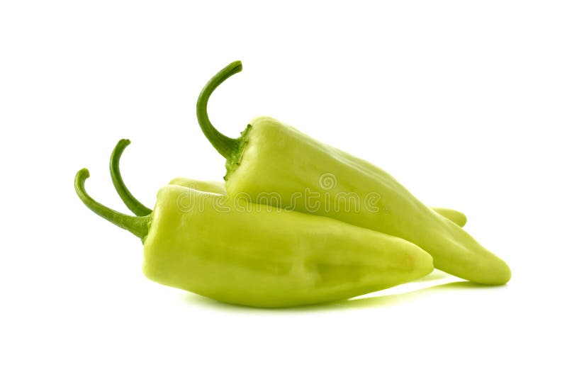 Green chili peppers with stem on white background