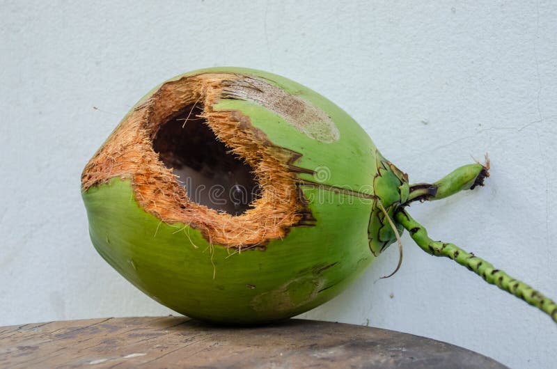 Green Coconut with Hole on Table Stock Image - Image of hungry ...