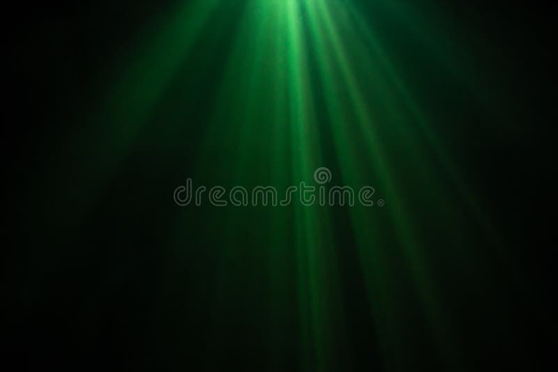 Green color wide lens projector with light beam for movie and cinema at night . smoke texture spotlight . black background royalty free stock photography Green color wide lens projector with light beam for movie and cinema at night . smoke texture spotlight . black background royalty free stock photography