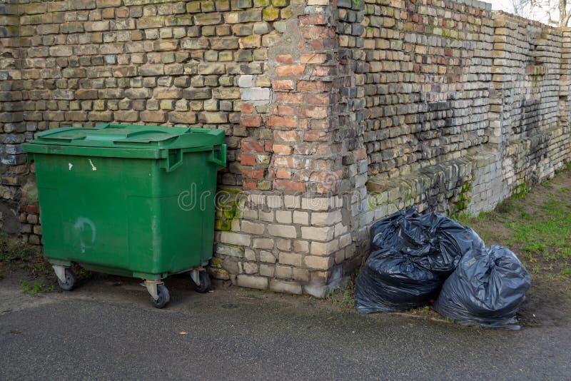 Pile Of Black Garbage Bag On The Street Stock Photo, Picture and Royalty  Free Image. Image 39347140.