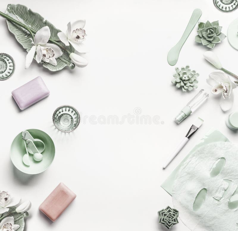 Green Cosmetic setting for facial skin care with white orchid flowers, tools , sheet mask and accessories stock images Green Cosmetic setting for facial skin care with white orchid flowers, tools , sheet mask and accessories stock images