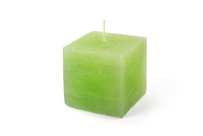 Green cube-shape candle on white background royalty free stock image