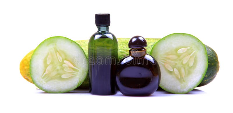Green cucumber spa oil stock photography
