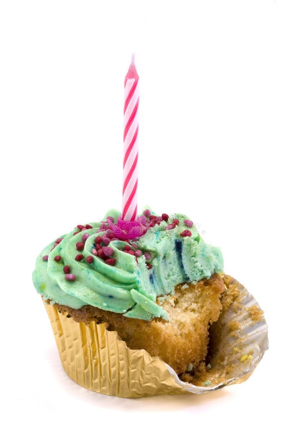 Green cupcake with candle and bite missing