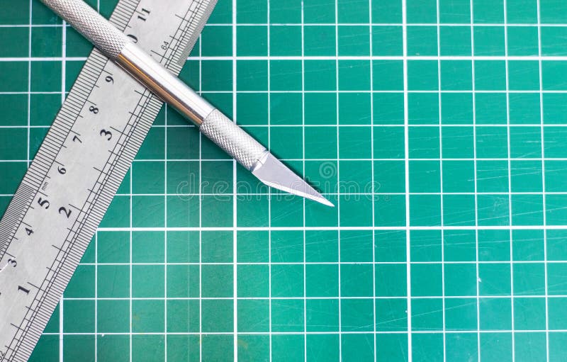 Green Cutting Mat and Metal Ruler Stock Photo - Image of material