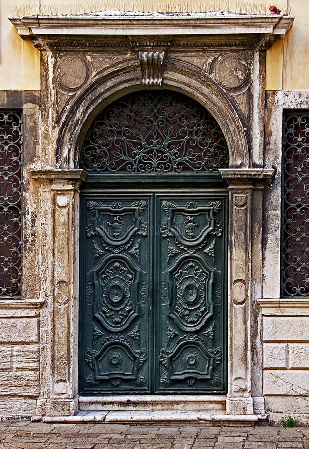 Green decorated carved door in Venice Ghetto.