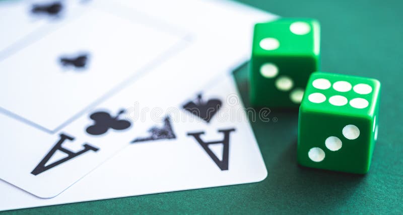 Green dice and playing cards