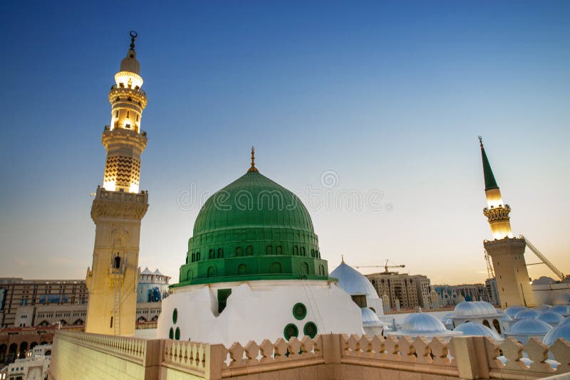 The Green dome of prophet Mohammed between two Minaret .