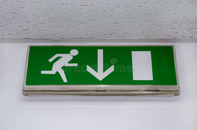 Green emergency exit sign showing the way to escape royalty free stock photography Green emergency exit sign showing the way to escape royalty free stock photography